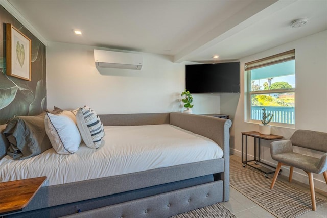 bedroom with a wall mounted air conditioner and light tile patterned flooring