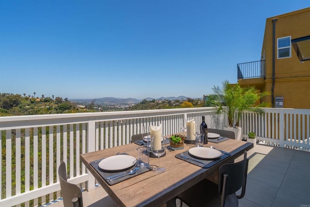 wooden deck with a mountain view