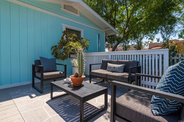 deck featuring a patio area and an outdoor hangout area