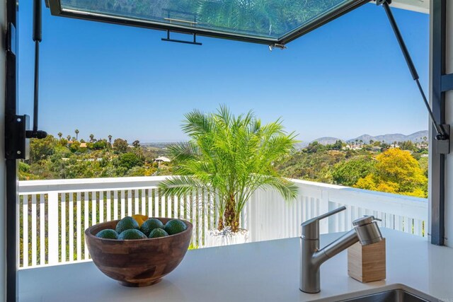 balcony featuring a mountain view