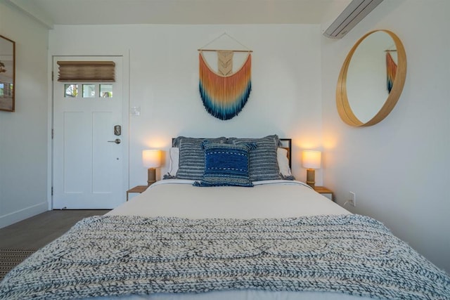 bedroom with a wall mounted air conditioner