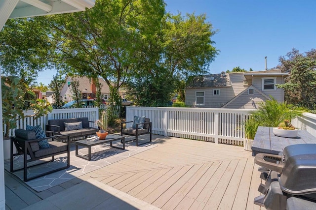 deck featuring outdoor lounge area and a grill