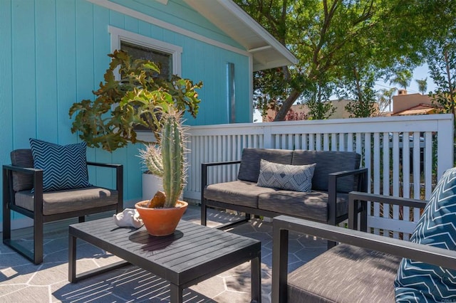 wooden terrace with a patio area and an outdoor hangout area