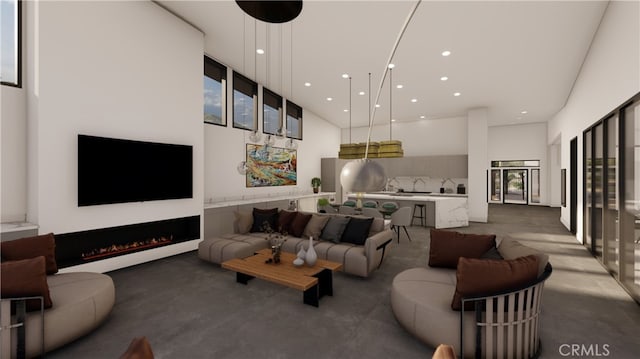 living room featuring concrete floors and a high ceiling