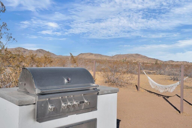 exterior space with grilling area and a mountain view