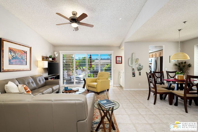 living room featuring a textured ceiling and ceiling fan