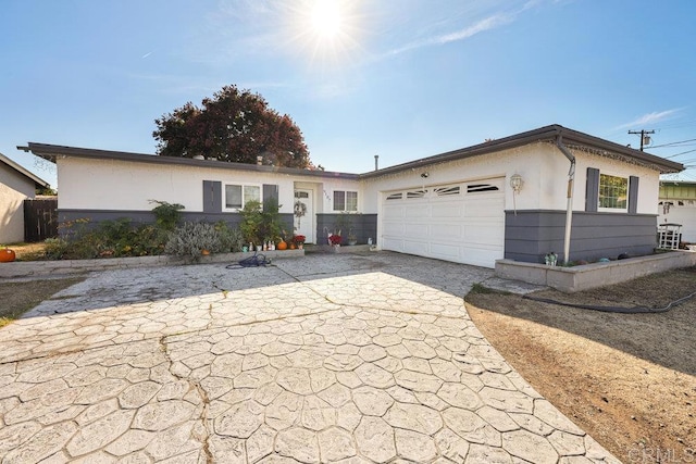 single story home featuring a garage