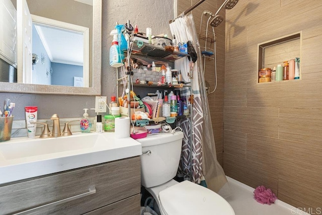 bathroom featuring vanity, curtained shower, and toilet