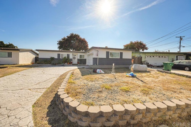 single story home featuring a garage