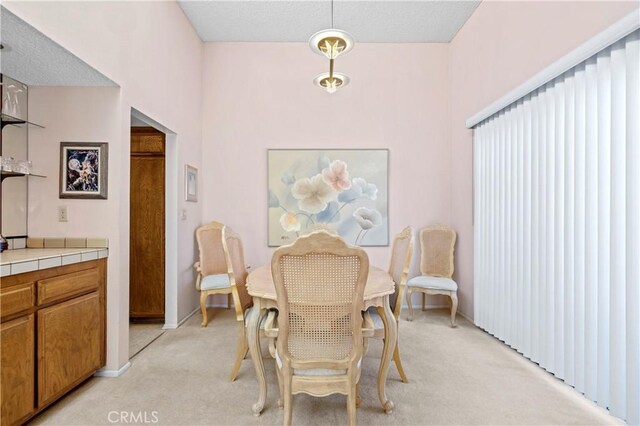 view of carpeted dining area