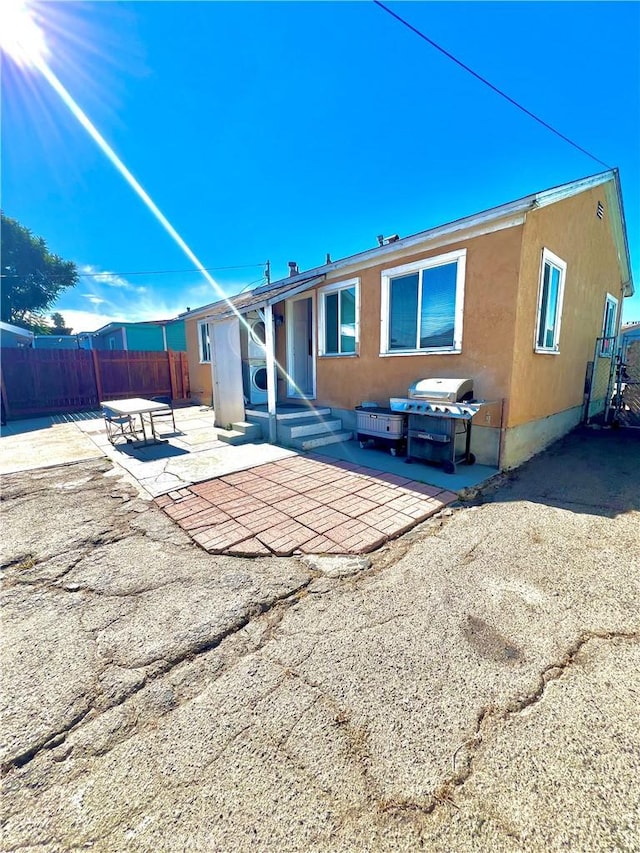 rear view of property with a patio area