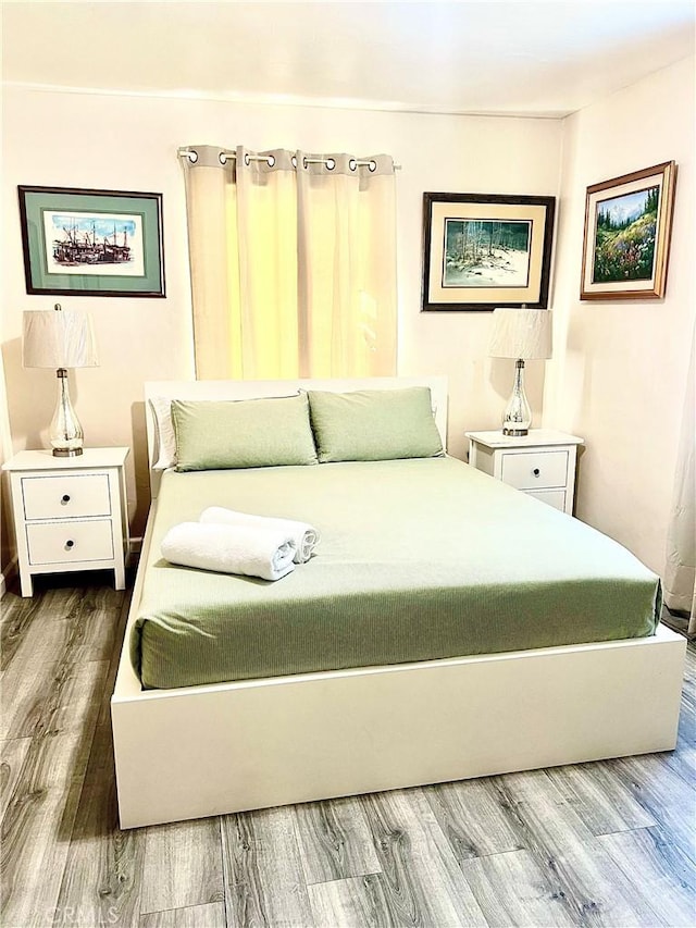 bedroom featuring hardwood / wood-style floors