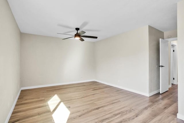 unfurnished room with ceiling fan and light hardwood / wood-style floors