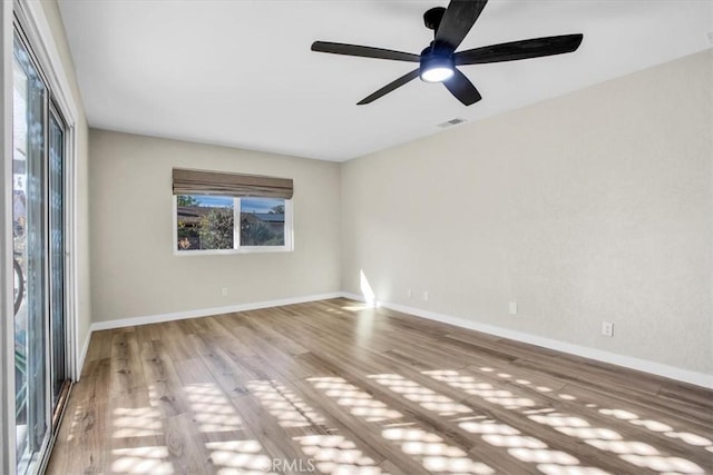 unfurnished room with ceiling fan and light wood-type flooring