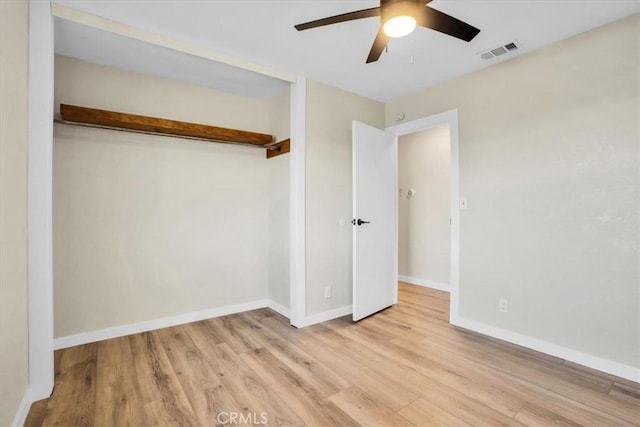 unfurnished bedroom featuring a closet, ceiling fan, and light hardwood / wood-style flooring