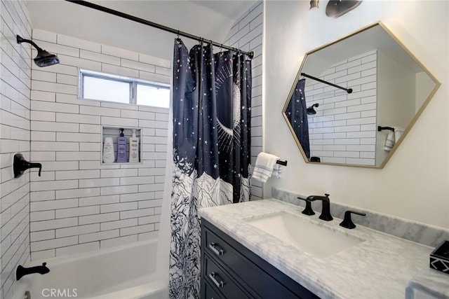 bathroom with shower / tub combo and vanity