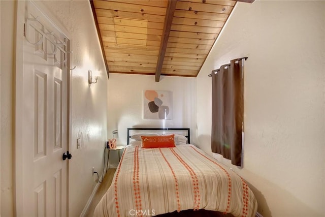 bedroom with wooden ceiling and lofted ceiling with beams