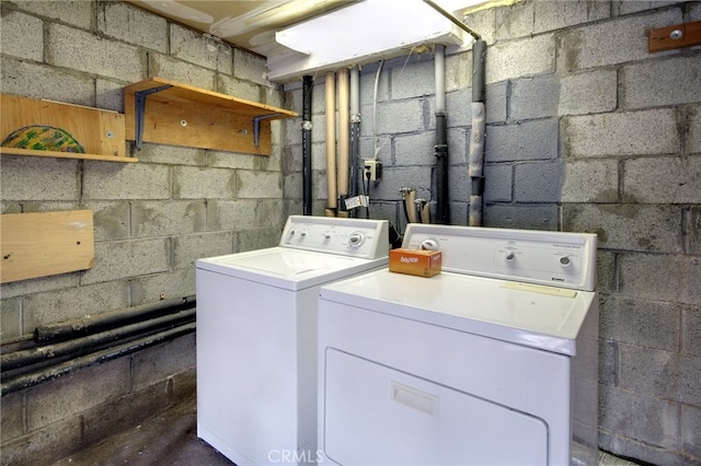 laundry area featuring washing machine and clothes dryer