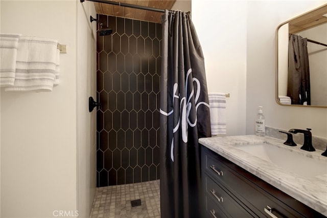 bathroom with vanity and a shower with shower curtain