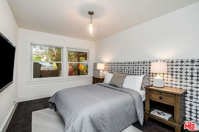 bedroom featuring dark hardwood / wood-style flooring