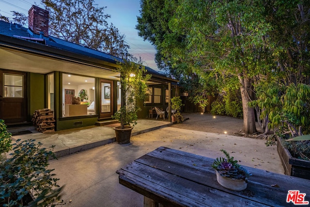 view of patio terrace at dusk