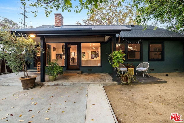 back of house with a patio