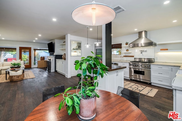 dining area with a fireplace and dark hardwood / wood-style flooring