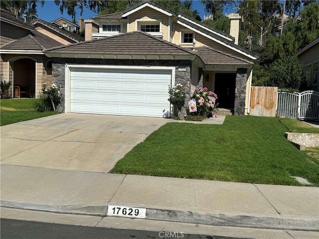 view of front of house featuring a front yard and a garage