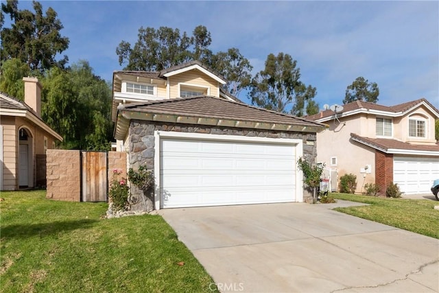 front facade featuring a front yard and a garage