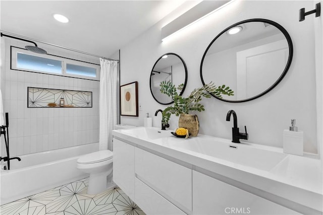 full bathroom with tile patterned floors, shower / tub combo with curtain, vanity, and toilet