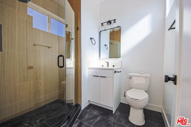 bathroom with vanity, toilet, and walk in shower