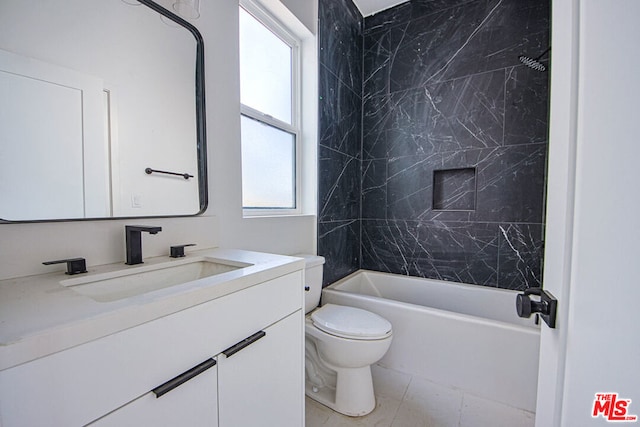 full bathroom featuring vanity, toilet, and tiled shower / bath combo