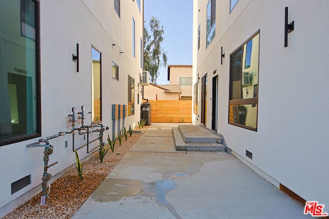 view of side of property featuring a patio area