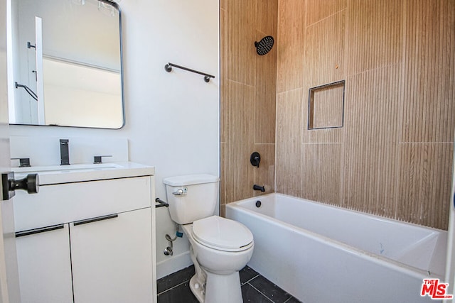 full bathroom featuring tiled shower / bath, vanity, toilet, and tile patterned flooring