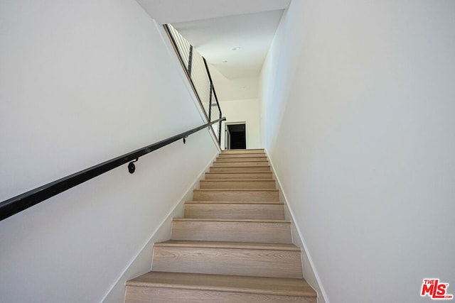 stairway with wood-type flooring