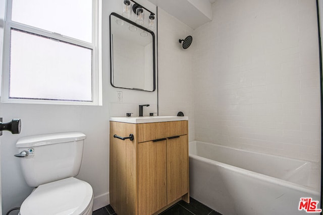 full bathroom featuring vanity, tiled shower / bath combo, tile patterned floors, and toilet