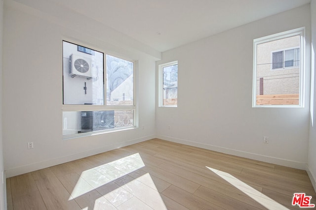 spare room featuring light wood-type flooring