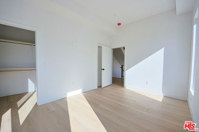 unfurnished bedroom with light wood-type flooring