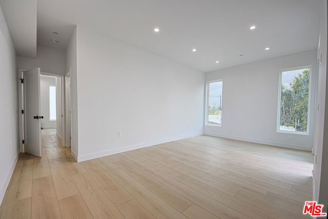 unfurnished room featuring light wood-type flooring