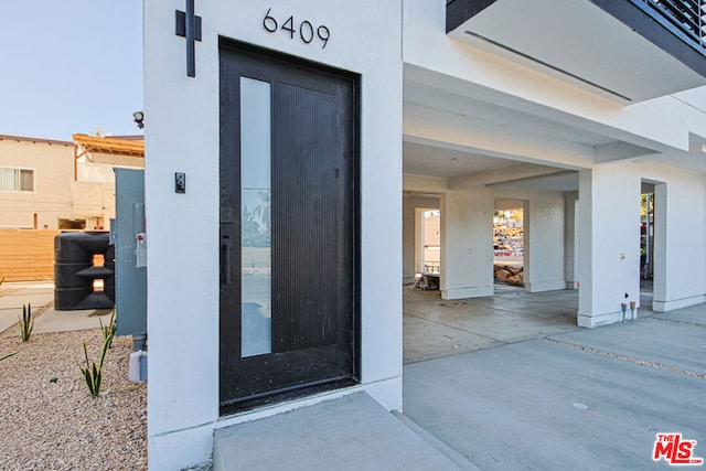 entrance to property with a wall mounted air conditioner