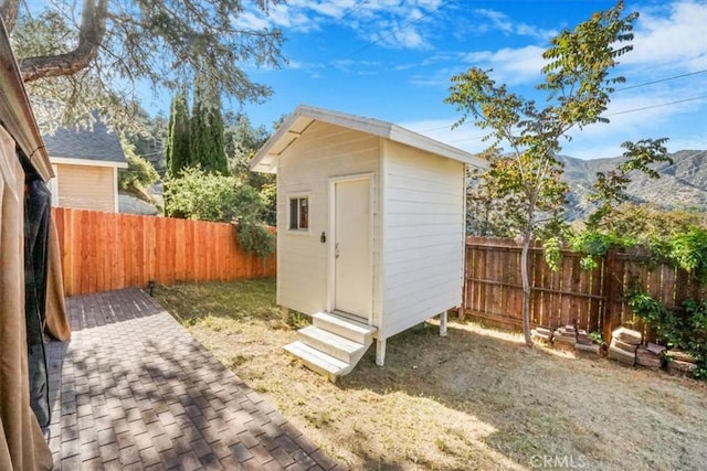 view of outbuilding featuring a mountain view