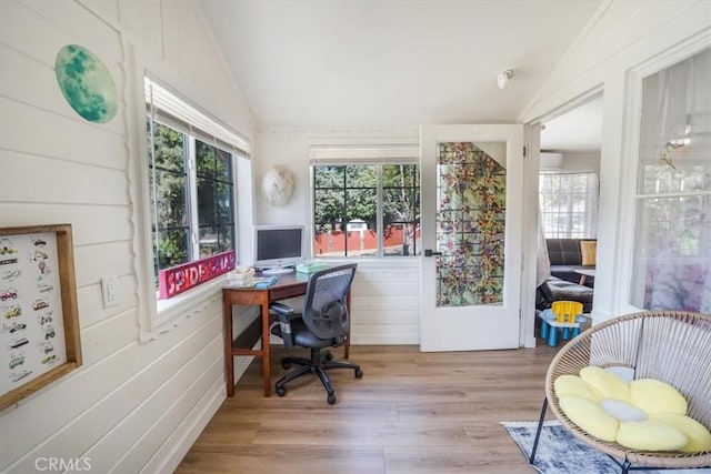 office featuring lofted ceiling and light wood-type flooring