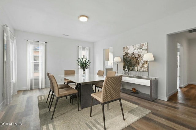 dining area featuring wood-type flooring