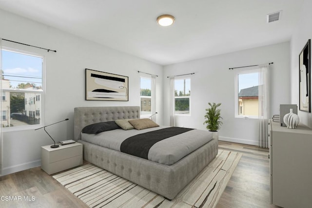 bedroom with light hardwood / wood-style flooring