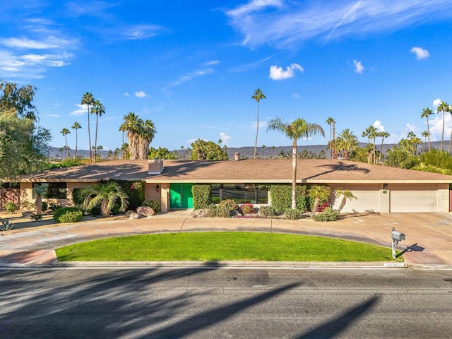 ranch-style house featuring a garage