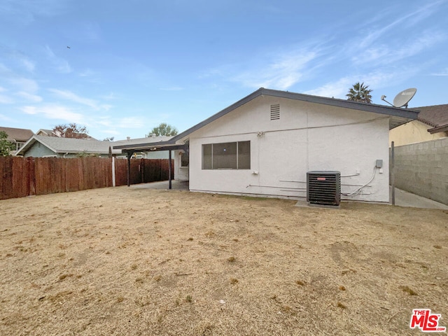 back of property with central AC unit