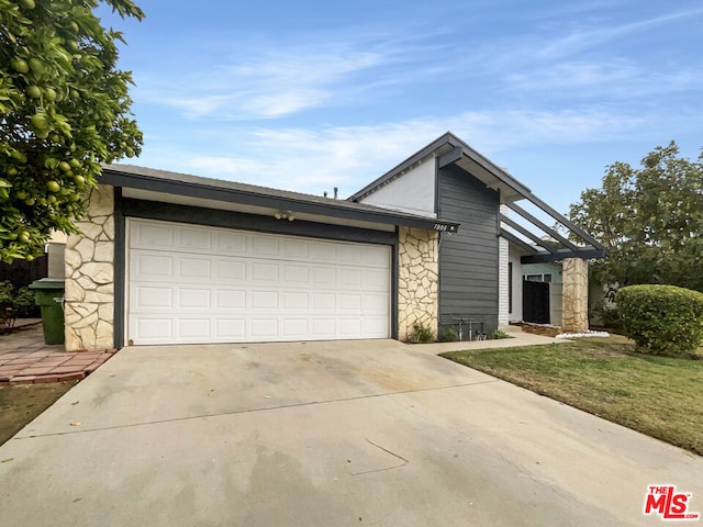 ranch-style house featuring a garage