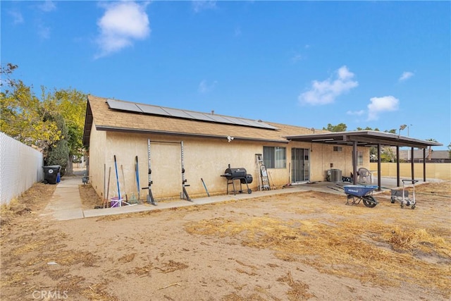 rear view of house with solar panels