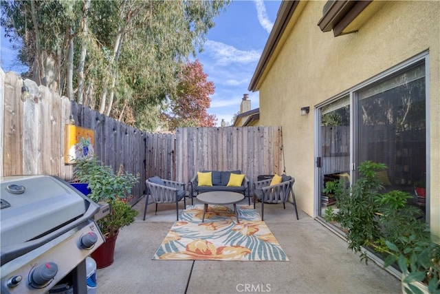 view of patio / terrace featuring an outdoor living space and grilling area