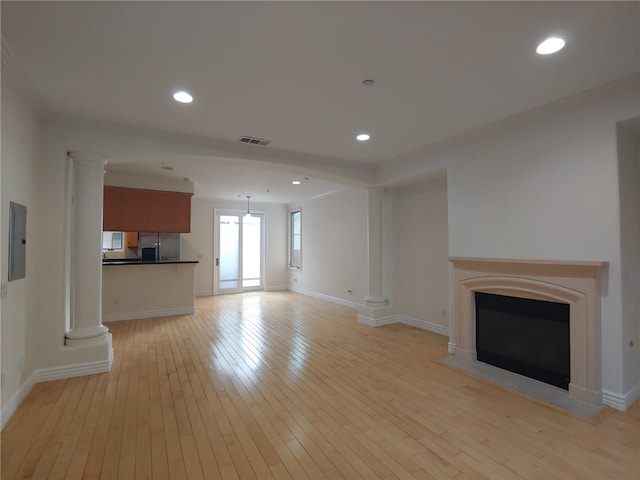 unfurnished living room featuring light wood-type flooring